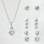 Sears Roebuck and Co. Silvertone/Crystal 4 Piece Earrings and Drop Pendant Set