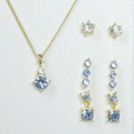Sears Roebuck and Co. Goldtone/Crystal/Sapphire 4 Piece Earrings and Drop Pendant Set