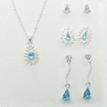 Sears Roebuck and Co. Goldtone/Crystal/Aquamarine 4 Piece Earrings and Teardrop Pendant Set