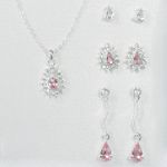 Sears Roebuck and Co. Silvertone/Crystal/Lt. Rose 4 Piece Earrings and Teardrop Pendant Set