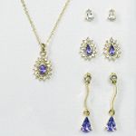 Sears Roebuck and Co. Silvertone/Goldtone/Tanzanite 4 Piece Earrings and Teardrop Pendant Set