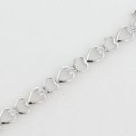 1/10 ct. tw. Diamond Heart Bracelet. 10Kt White Gold