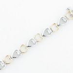 1/10 ct. tw. Diamond Heart Bracelet. 10Kt TwoTone Gold.