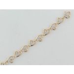 1/10 ct. tw. Diamond Heart Bracelet. 10Kt TwoTone Gold.